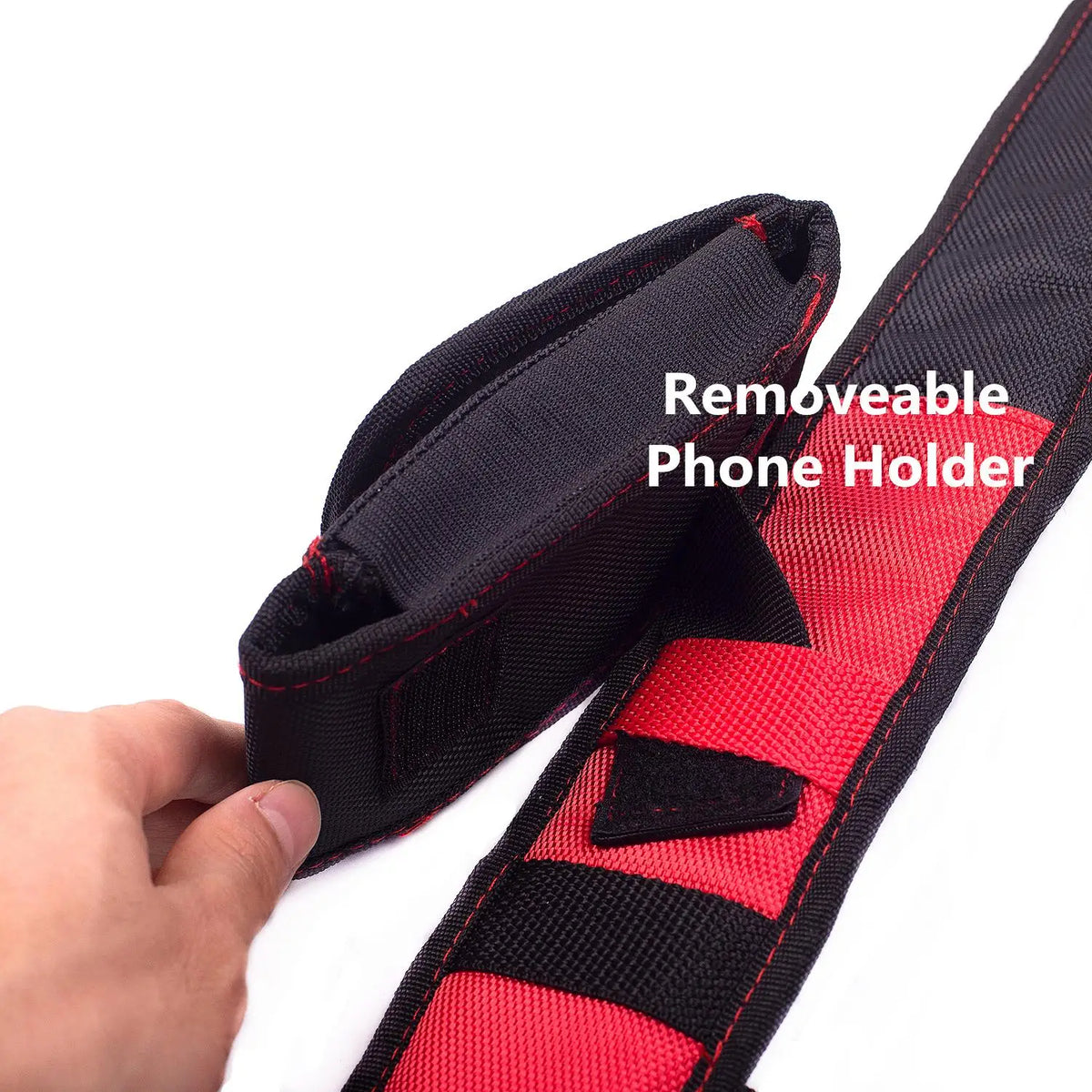 A black and red removable phone holder attached to a tool belt strap.