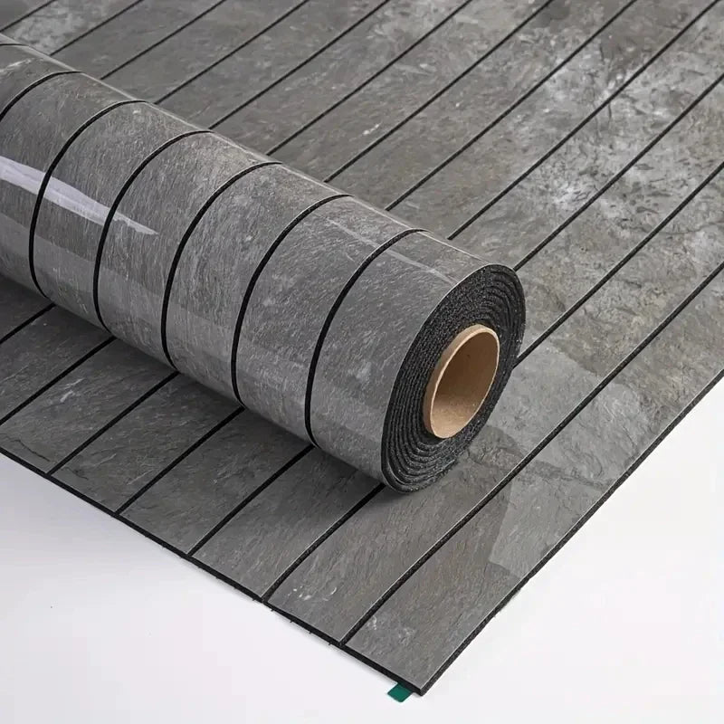 Roll of extra thick 3D wood grain self-adhesive wallpaper laid out on a gray tiled surface.