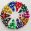 A circular arrangement of seven polyhedral dice in various colors including blue, red, yellow, and green.