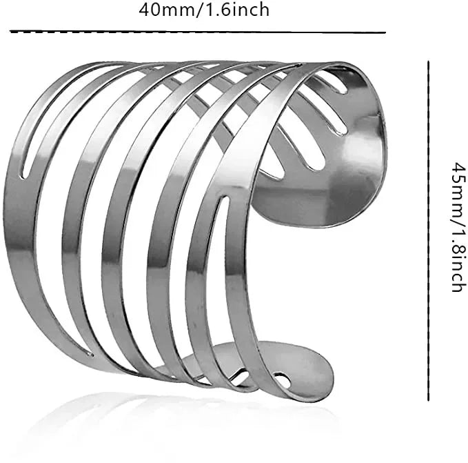 A set of twelve silver metal napkin rings with a decorative hollow-out pattern.
