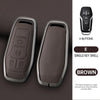 A dark brown leather car key case cover with a silver finish and four buttons shown next to the product.
