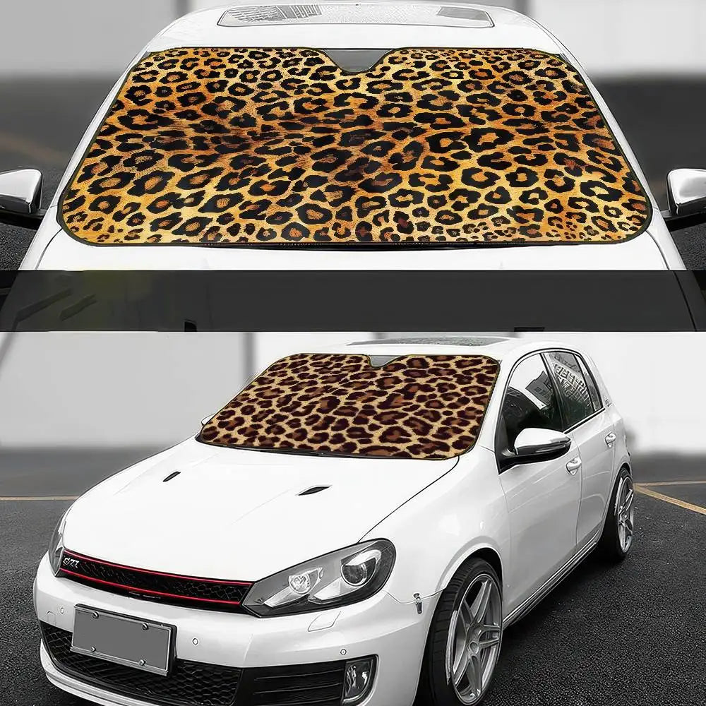 A white car with a leopard print sunshade covering the windshield.