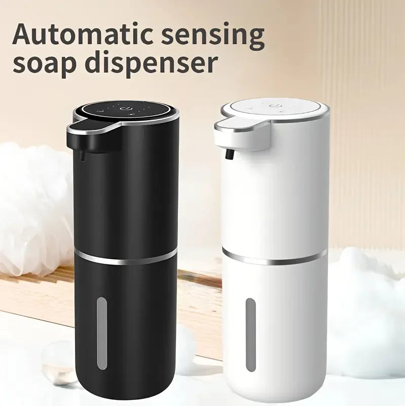 A black and white automatic sensing soap dispenser is shown on a wooden surface.