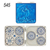 A blue dragon-themed metal dice set featuring a dragon design and multiple dice faces.