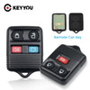 A black replacement remote car key fob and spare key shown next to a small electronic remote key.