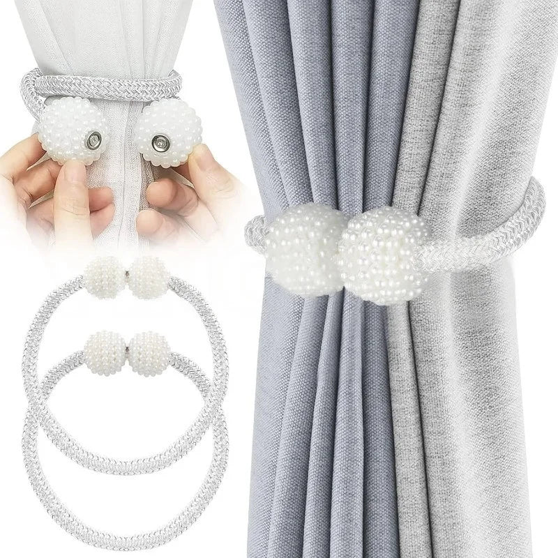 Pearl magnetic curtain tiebacks with strong hold used to secure a gray and white fabric drape.