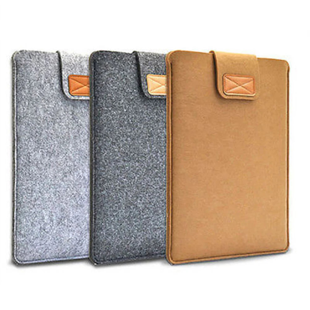 Three felt laptop sleeves in gray, charcoal, and tan with leather accents.