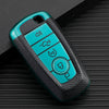 A teal TPU leather car key cover with multiple buttons rests on a dark textured surface.