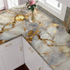 Golden marble peel-and-stick backsplash featuring gold veining on white marble surface.
