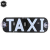 Black LED taxi indicator light panel with the word TAXI illuminated on it