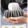 A hand holds a grey laundry ball, demonstrating the small and large use of this laundry cleaning ball.