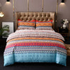 A bed featuring a boho striped geometric duvet cover set with colorful patterns and pillows.