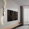 A modern minimalist LED wall lamp illuminates a dark rectangular artwork on a white wall.