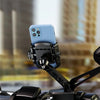A light blue smartphone is mounted on a black quick-release motorcycle or bike phone mount.