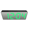 A digital weather station clock displaying the time 12:04 with bright green LED numbers.