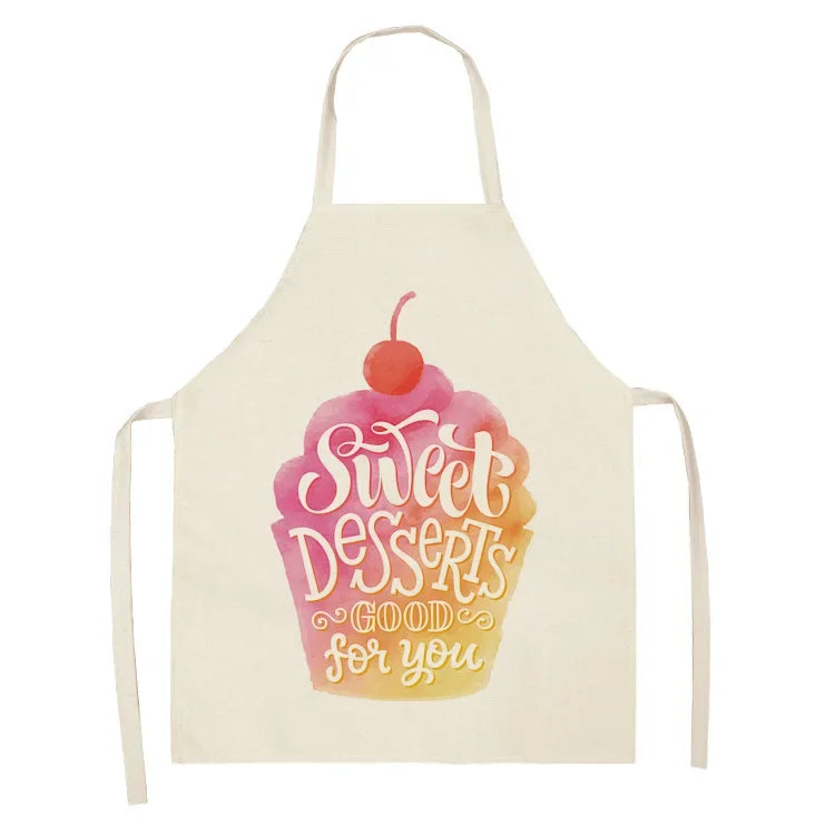 A light yellow apron featuring a pink swirl cupcake design with the text Sweet Desserts good for you