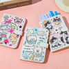 A set of four pink and white cartoon puppy themed leather passport holders and travel wallets