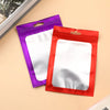Two colorful mylar ziplock bags, purple and red, with clear windows for jewelry and small item packaging.