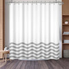 White shower curtain featuring a gray wavy stripe pattern