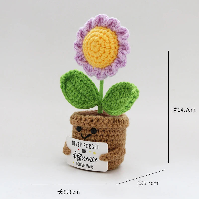 Handmade crochet flower plant decor featuring a purple and yellow bloom on a green stem and brown pot.
