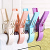 A collection of heavy-duty laundry clips in various colors including beige, pink, blue, and purple.