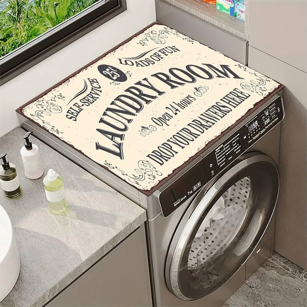 A laundry room featuring a stainless steel washer and dryer with a decorative mat on top.
