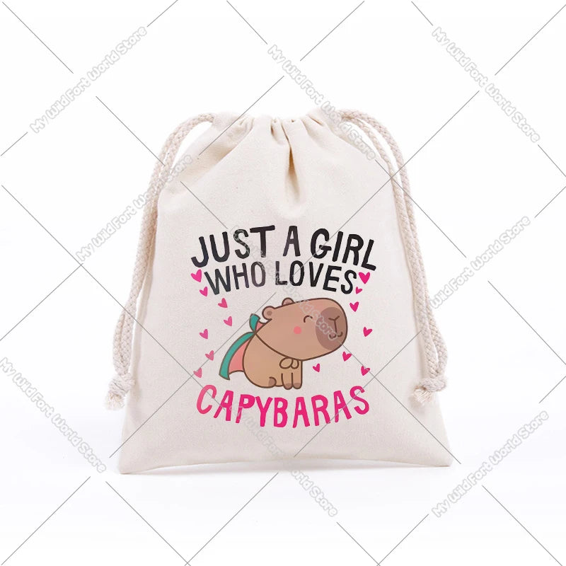 A beige drawstring storage bag featuring text that reads Just a girl who loves capybaras and an illustration of a capybara.