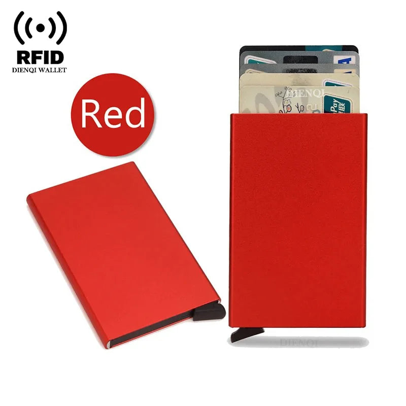 A red slim metal RFID blocking card holder with a pop-up design and a stack of cards.