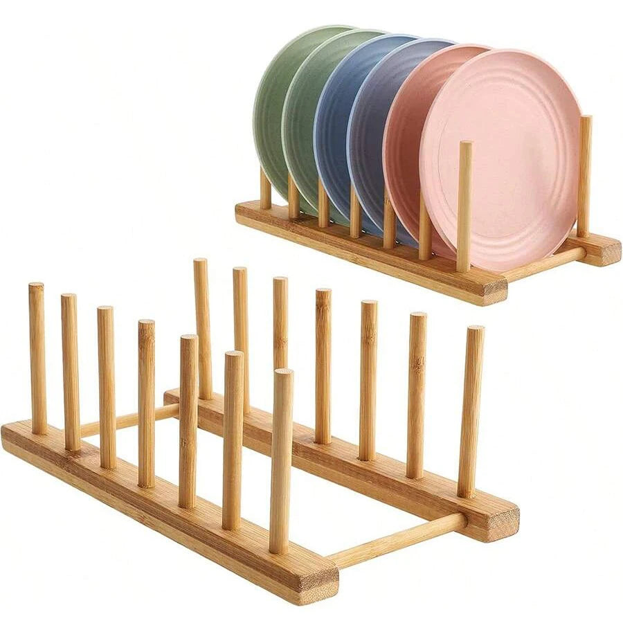 A wooden bamboo dish drying rack holding a stack of five pastel colored plates.