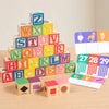 A tower of wooden alphabet blocks spelling out the English alphabet for early learning.