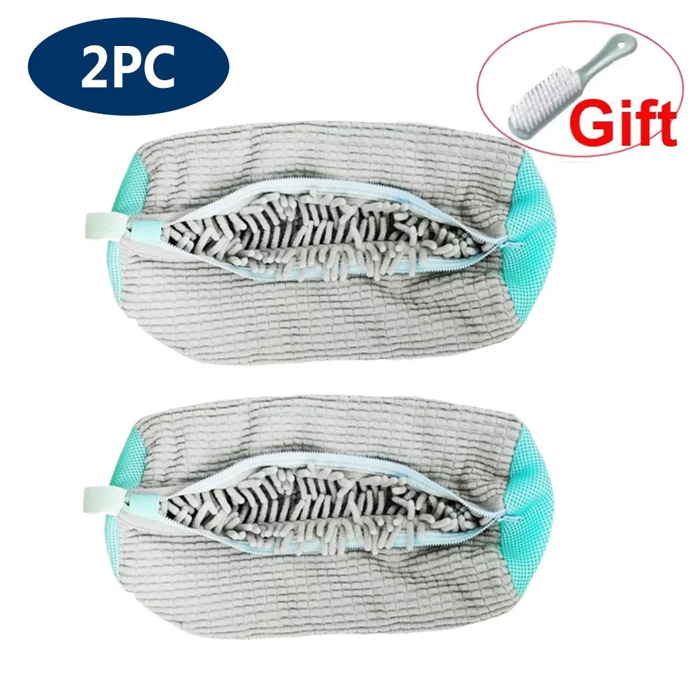 Two reusable mesh laundry bags for shoes, gray and teal, shown next to a brush.