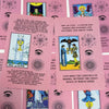 A collection of pink Rider-Waite Tarot cards featuring various Major Arcana and suit cards.