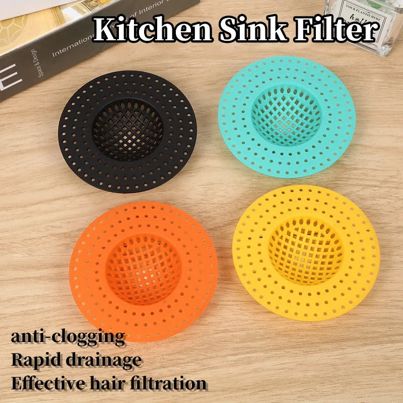 Four silicone kitchen sink filters in black, teal, orange, and yellow for anti-clogging and hair filtration