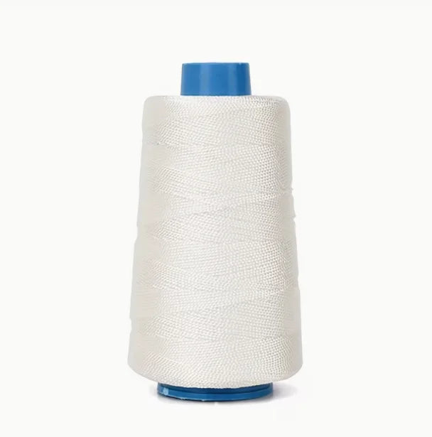 A spool of white heavy-duty waxed nylon thread with a blue core for sewing and repairs.