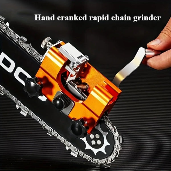 Hand cranked rapid chain grinder in orange and black on a black surface.