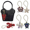Handcrafted rhinestone bag charms featuring a sequin octopus and turtle pendant keychains.
