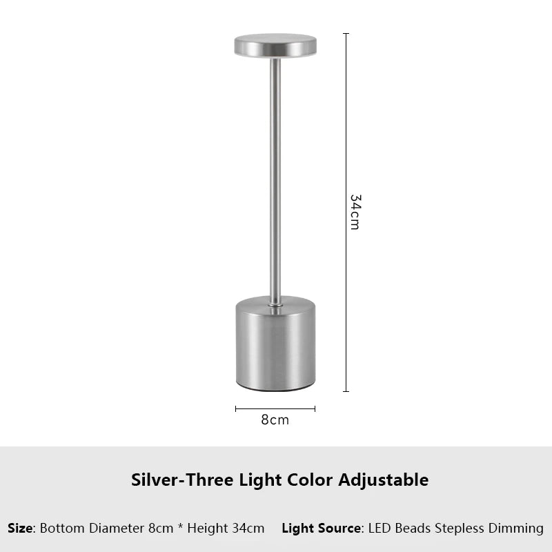 Silver three light color adjustable LED table lamp with a cylindrical base and a vertical stand