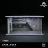 A 1:64 scale miniature garage diorama kit featuring a detailed brick facade and lighting elements.