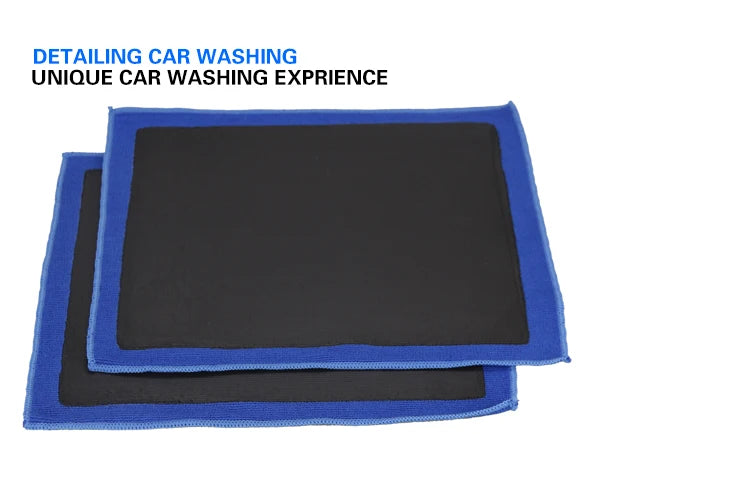 A set of blue and black detailing towels used for car washing and paint decontamination.
