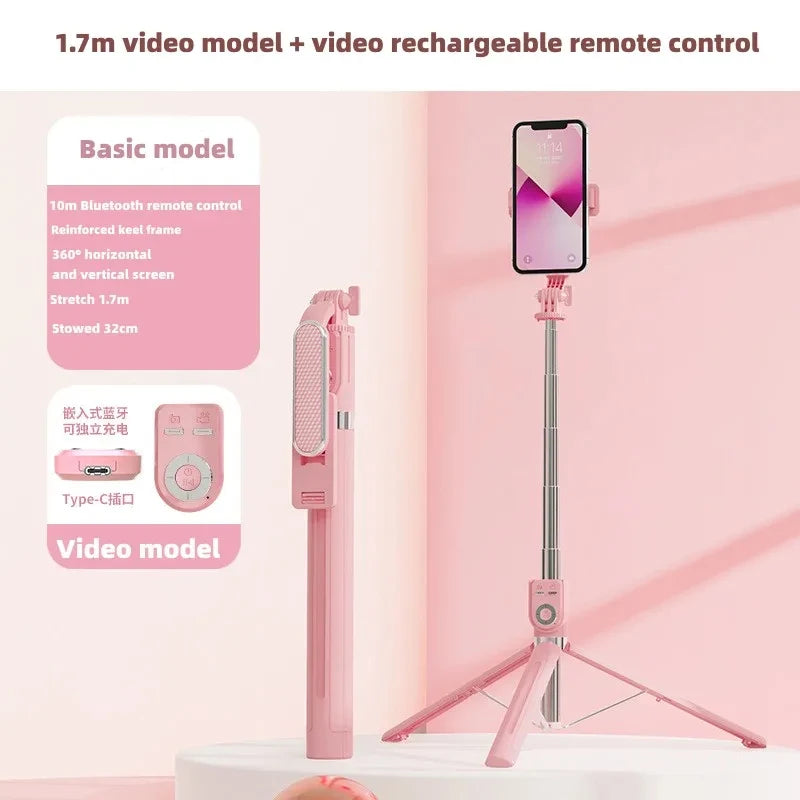 Rosa Selfie-Stab mit Smartphone, neben einer Fernbedienung