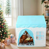 A white play tent with a light blue roof and an arched entrance, featuring a brown stuffed animal inside.