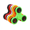 A collection of colorful smooth-spin fidget spinners in red, black, white, yellow, and orange.
