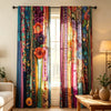 Two colorful boho ethnic patchwork print curtains hanging in a window frame.