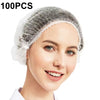 A woman is wearing a disposable non-woven bouffant cap for hair, shown in a close-up view.