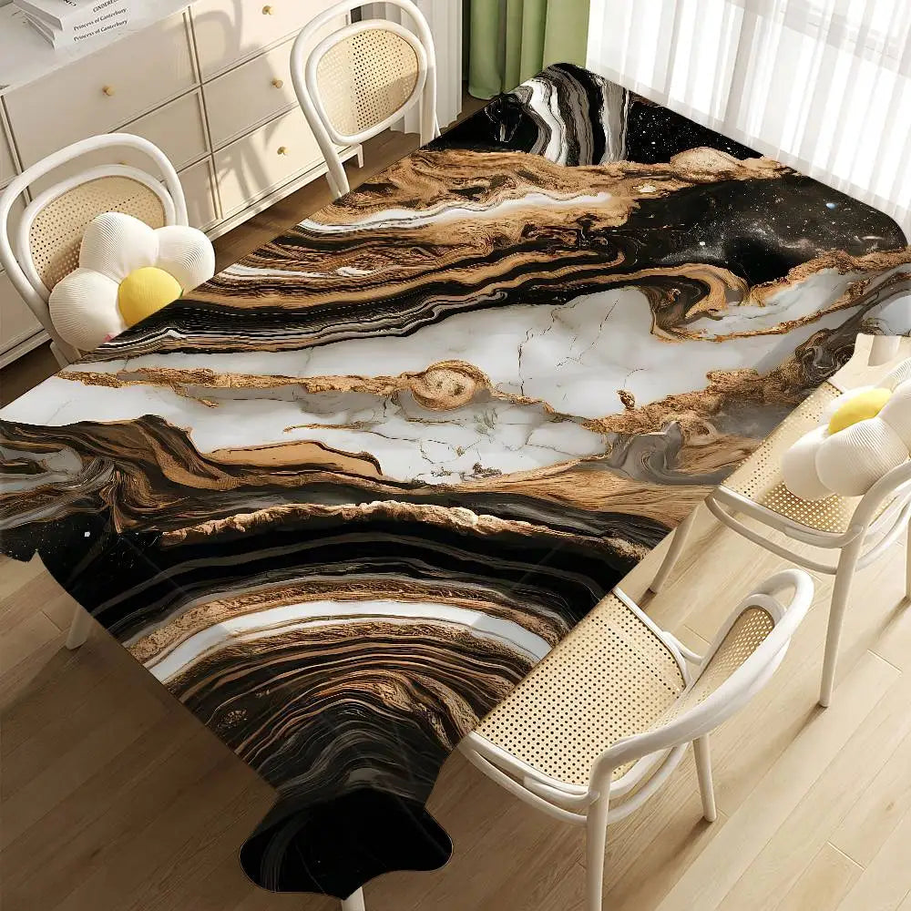 Black gold marble waterproof tablecloth displayed on a wooden floor with white wicker chairs.