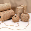 Rolls of natural jute twine used for crafts, gift wrapping, and décor