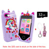 A purple kids smart phone toy with a camera and a memory card is shown next to the 32GB SD card.