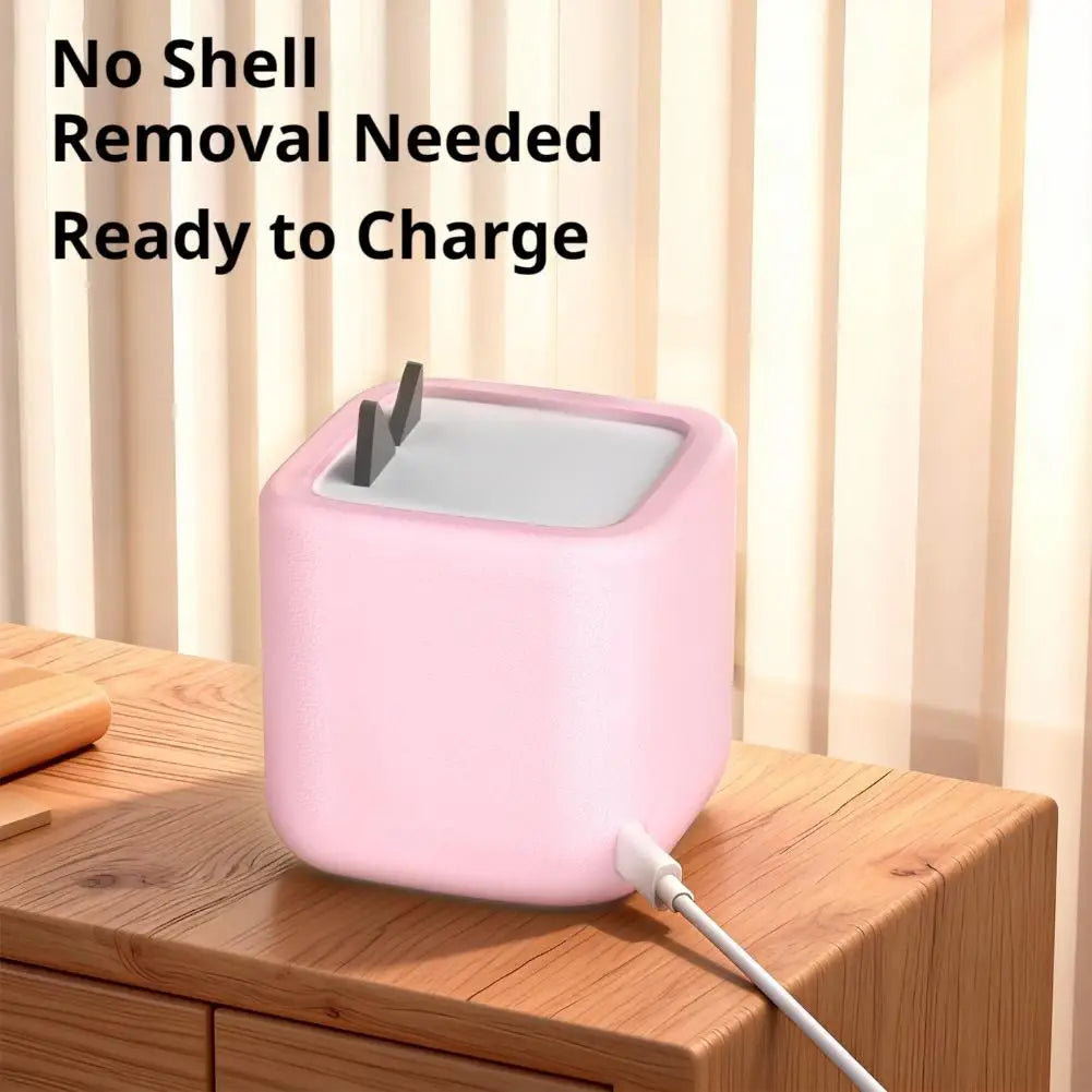 Pink silicone protective case for a Toniebox 2 audio player ready to charge