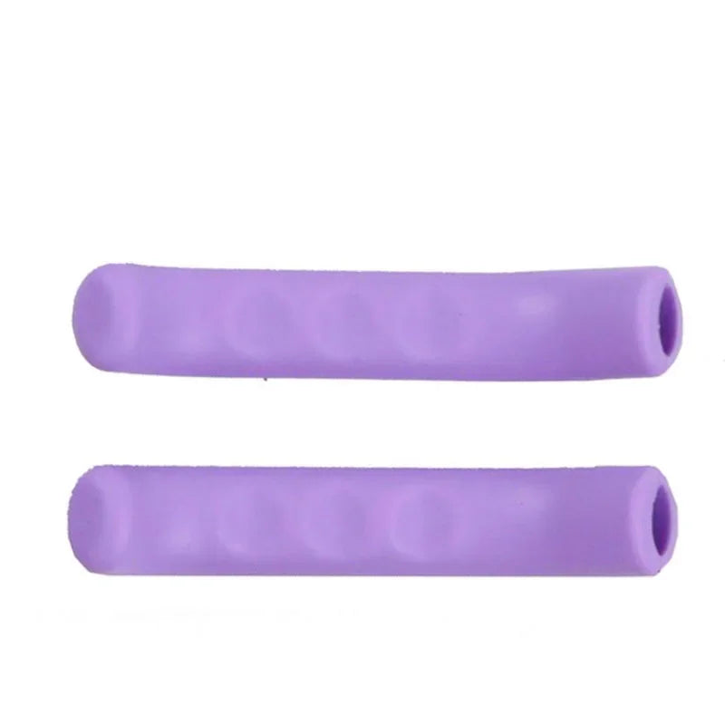 A pair of purple silicone bicycle brake lever covers.