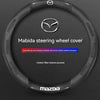 Black carbon fiber steering wheel cover for Mazda models featuring the Mazda logo and text